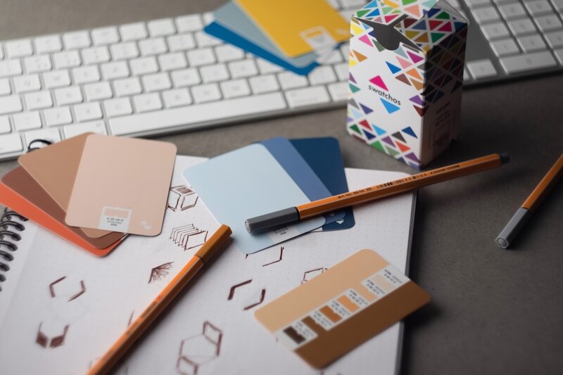 Creative desk with colour palette and design tools