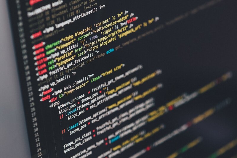 Code on a monitor representing vibe coding cleanup and AI-generated code rescue