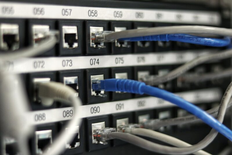 A blue network cable lying unplugged, representing an upstream model supply being disconnected from a development tool