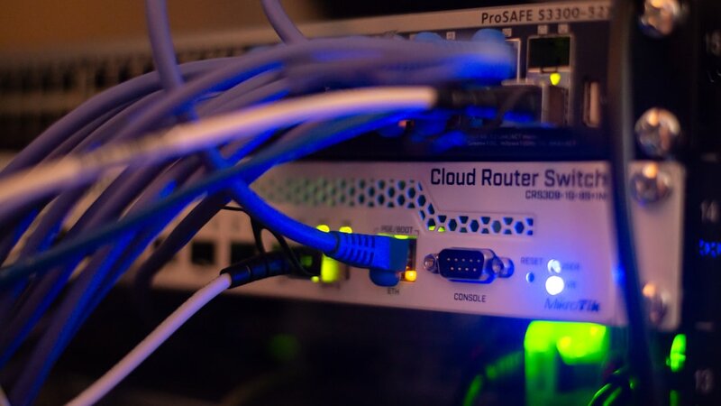 Close-up of network cables connected to data centre infrastructure