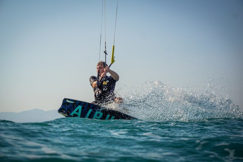 Kitesurfer racing across open water