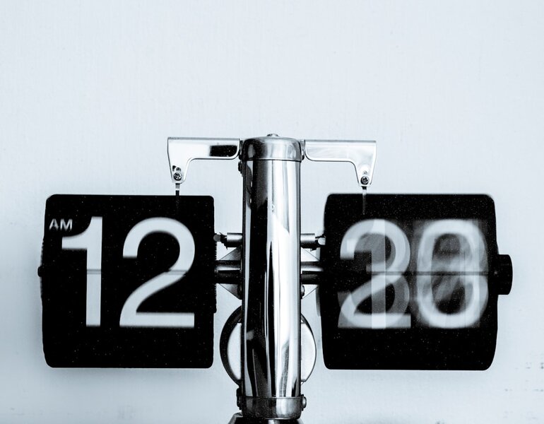 An analog wall clock, representing the countdown to a scheduled Next.js security release