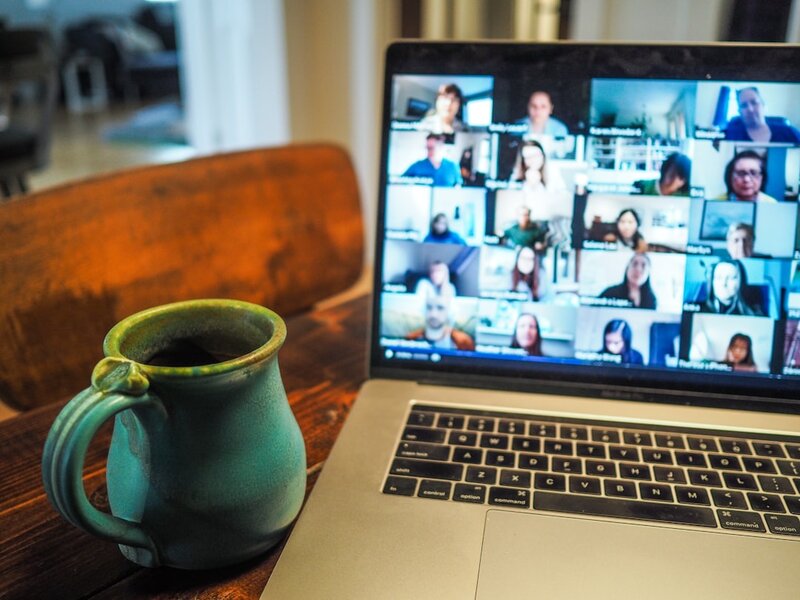 Laptop displaying a group video conference call