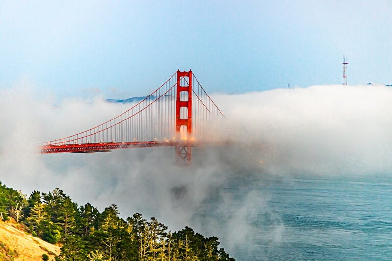 Golden Gate Bridge partially obscured by fog, illustrating the valley of webhook integration reliability