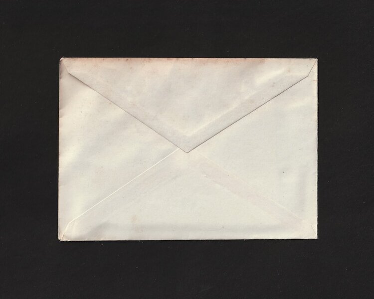 A single white envelope on a black background, unaddressed and unopened